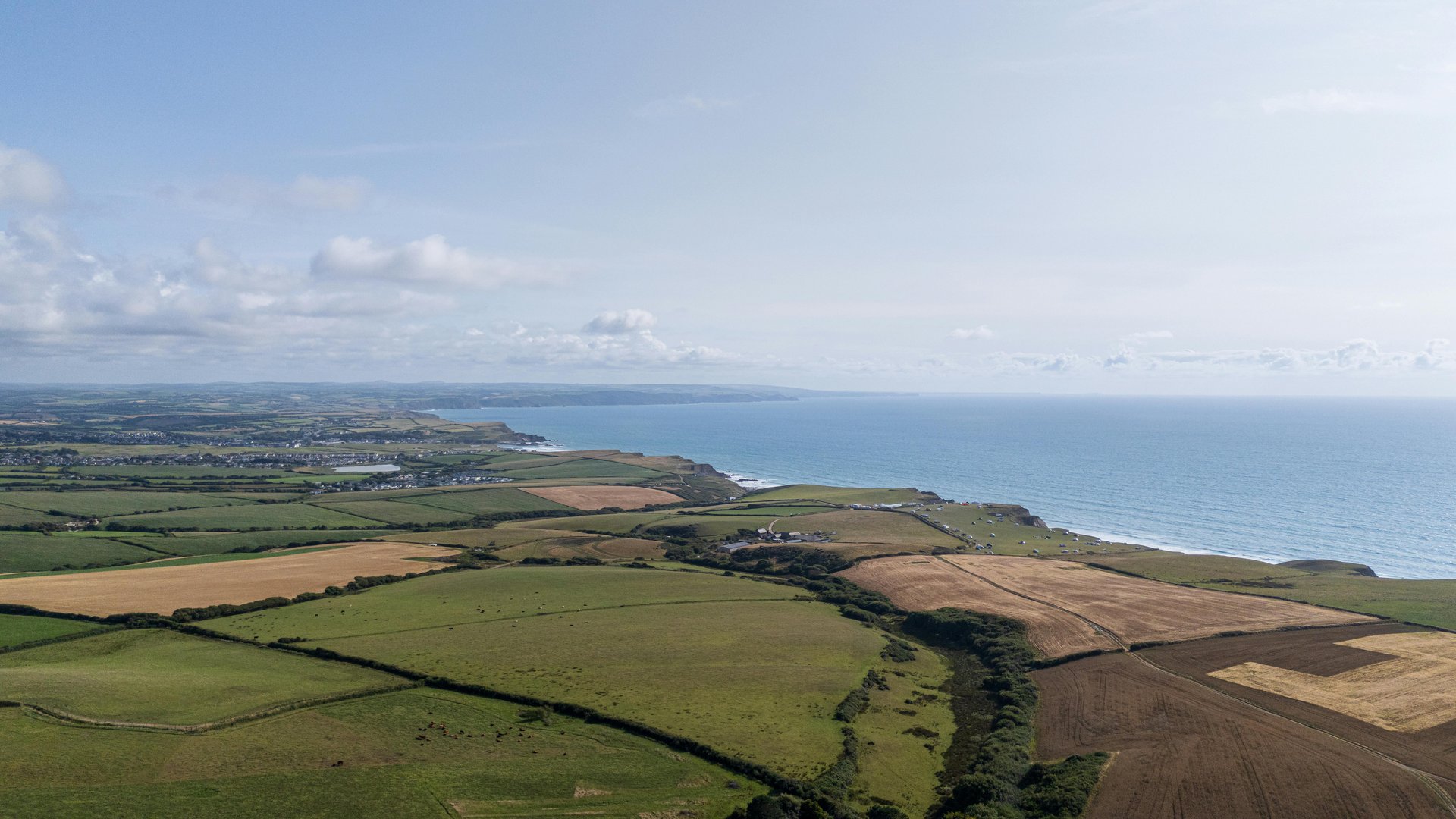 Aerial view of the Cornish coastline and farmland, England